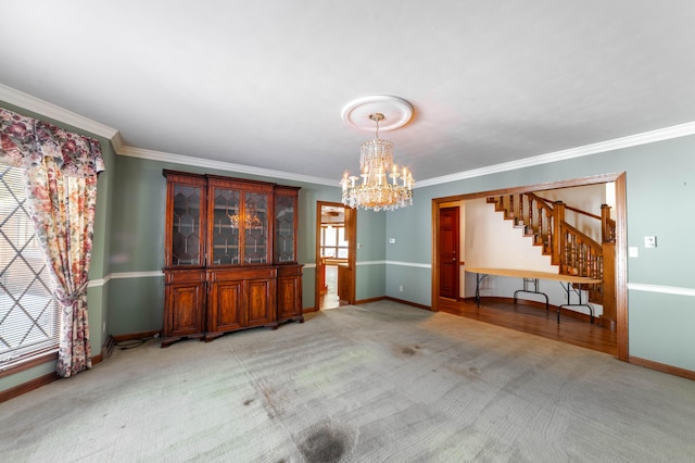 unfurnished dining area with ornamental molding, light carpet, and a notable chandelier