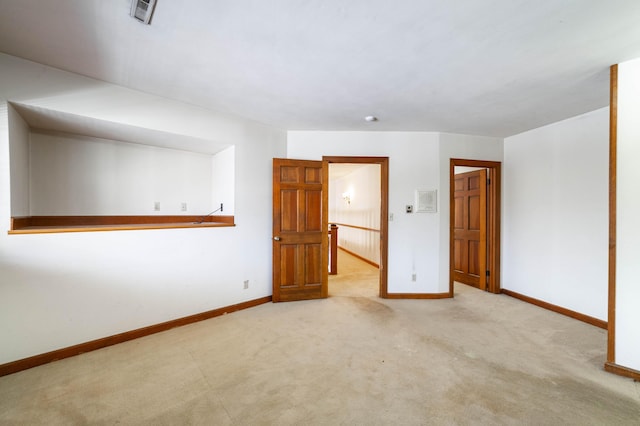 empty room with light colored carpet