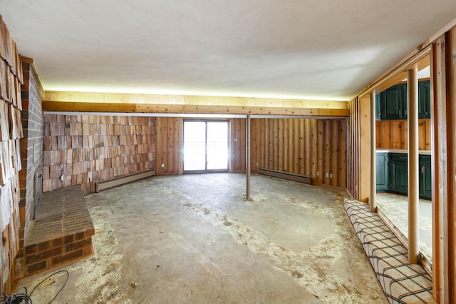 interior space featuring concrete flooring and baseboard heating