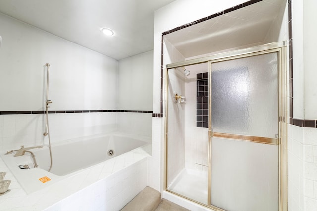 bathroom with shower with separate bathtub