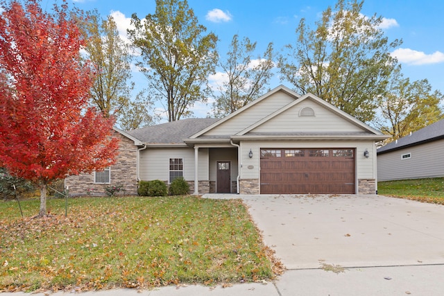 view of front of house featuring a garage and a front yard