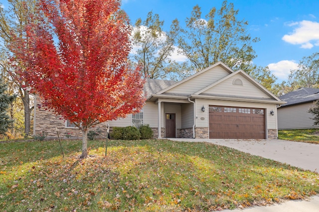 view of front of home featuring a garage and a front lawn