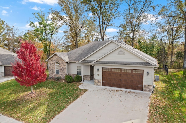 view of front of house featuring a front yard and a garage