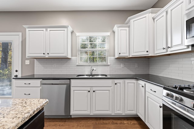 kitchen featuring white cabinets, plenty of natural light, and appliances with stainless steel finishes