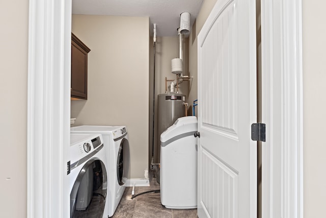 laundry room with cabinets, separate washer and dryer, and light tile patterned floors