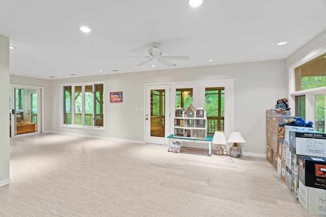 interior space with ceiling fan