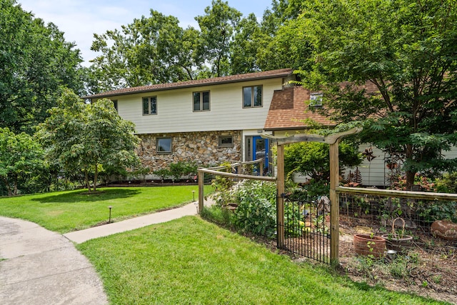 view of front of home with a front lawn