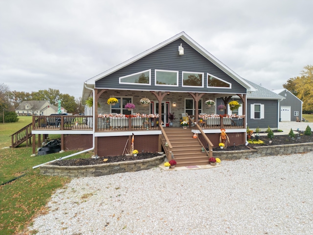 view of front of house with a wooden deck and covered porch