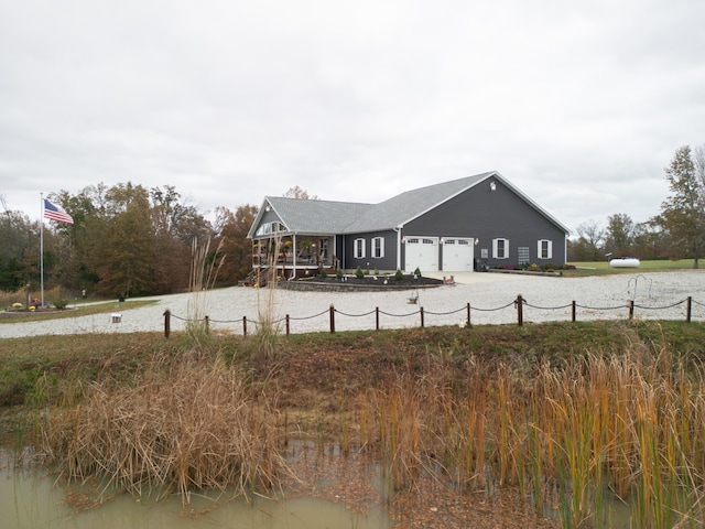 rear view of house with a garage