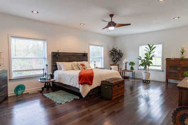 bedroom with ceiling fan and dark hardwood / wood-style floors