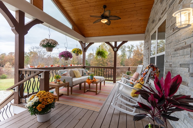 deck featuring ceiling fan and outdoor lounge area