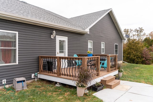 wooden deck with a lawn