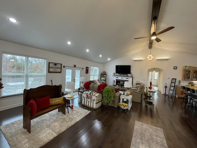 living room featuring ceiling fan, vaulted ceiling with beams, and dark hardwood / wood-style flooring