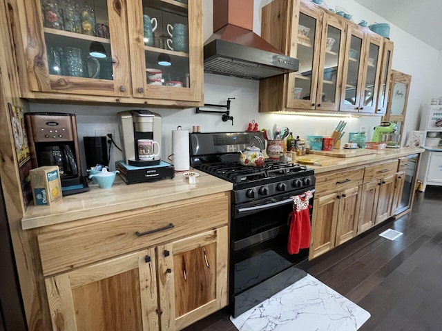 kitchen with dark wood-type flooring, exhaust hood, and black gas stove