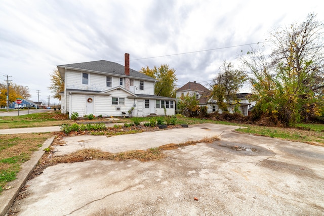 back of property with a garage