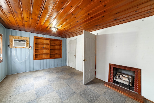 basement featuring wood walls, wood ceiling, a wall mounted air conditioner, and a brick fireplace