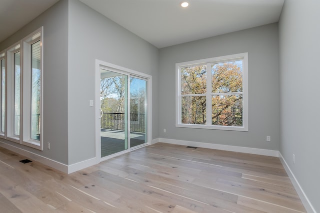 unfurnished room featuring light wood-type flooring