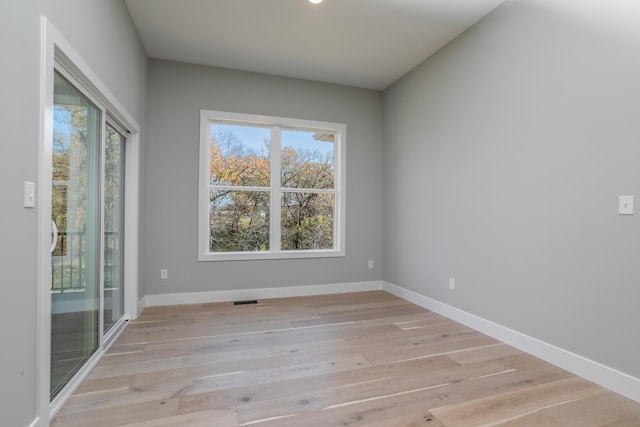 spare room featuring light hardwood / wood-style floors