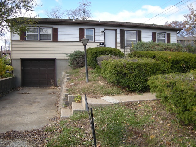 ranch-style house featuring a garage