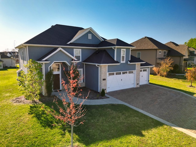 view of front of house with a front yard and a garage