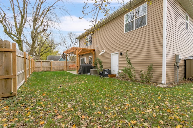 rear view of property featuring a lawn and a patio area