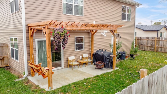 back of house with a patio area, a pergola, and a yard