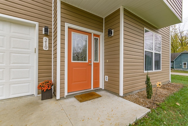 entrance to property featuring a garage