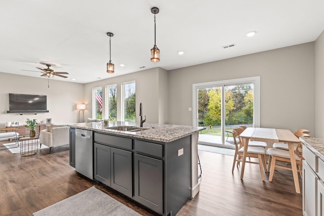 kitchen featuring a wealth of natural light, sink, dishwasher, and gray cabinets