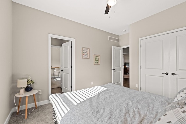 carpeted bedroom featuring ceiling fan and a closet