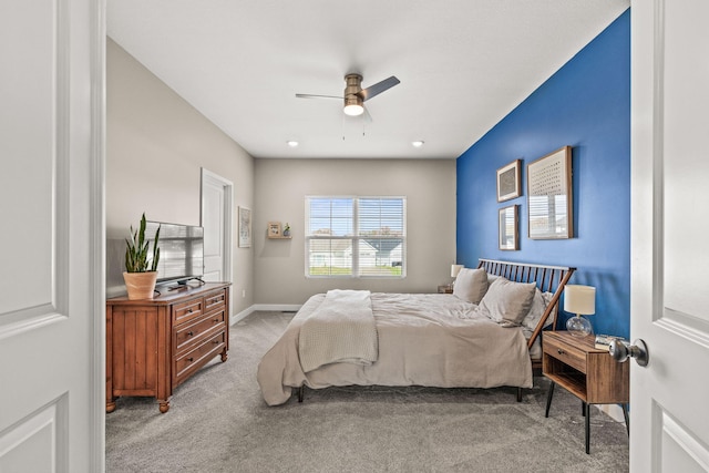 carpeted bedroom featuring ceiling fan