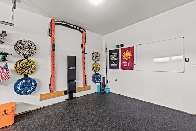 exercise area with a textured ceiling