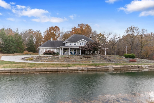 rear view of property featuring a water view