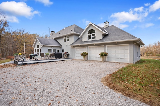 exterior space with a garage and a deck