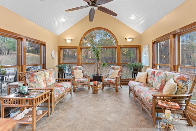 sunroom with vaulted ceiling, wood ceiling, and ceiling fan