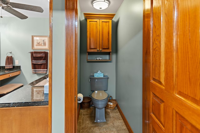 bathroom with toilet, tile patterned flooring, and ceiling fan