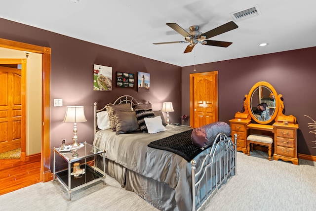 bedroom with hardwood / wood-style floors and ceiling fan