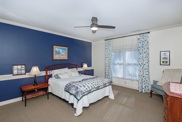 bedroom with carpet, a textured ceiling, ceiling fan, and ornamental molding