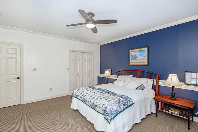 carpeted bedroom featuring ceiling fan, a closet, a textured ceiling, and ornamental molding