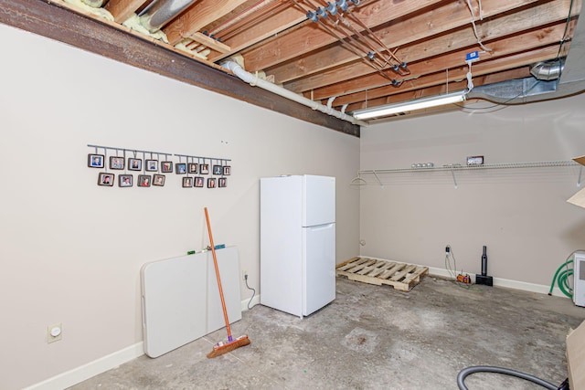 basement with white fridge