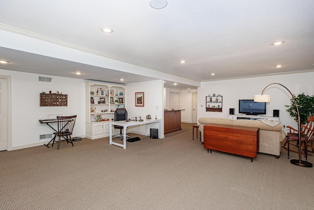 living room featuring built in shelves, crown molding, light colored carpet, and a textured ceiling