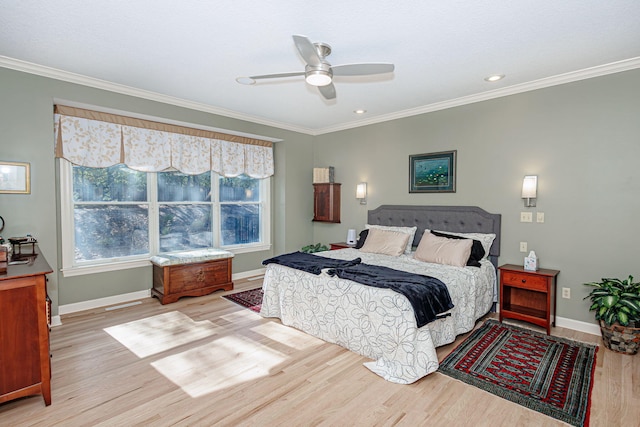 bedroom featuring ceiling fan, light wood-type flooring, and ornamental molding