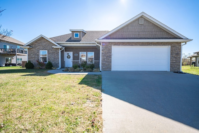 view of front facade with a garage and a front yard