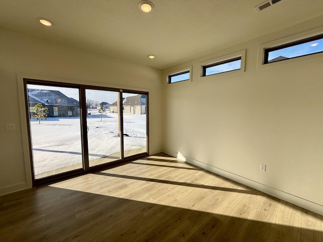 empty room featuring hardwood / wood-style floors