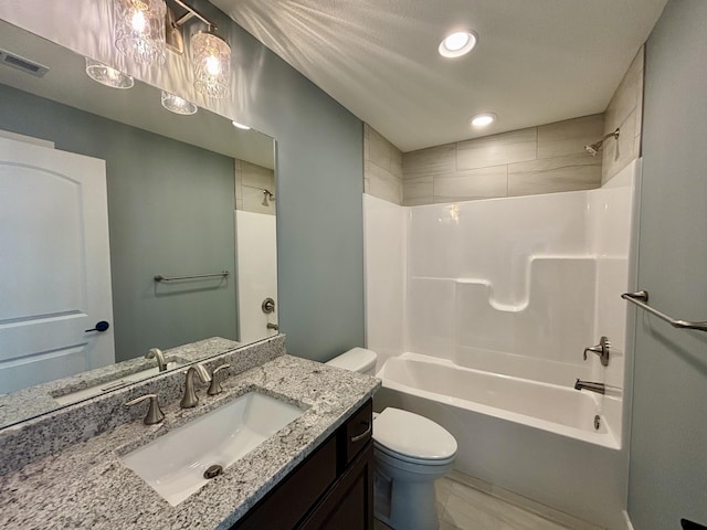 full bathroom with bathtub / shower combination, vanity, and toilet