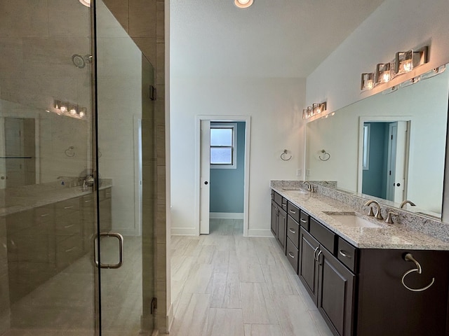 bathroom with vanity and an enclosed shower