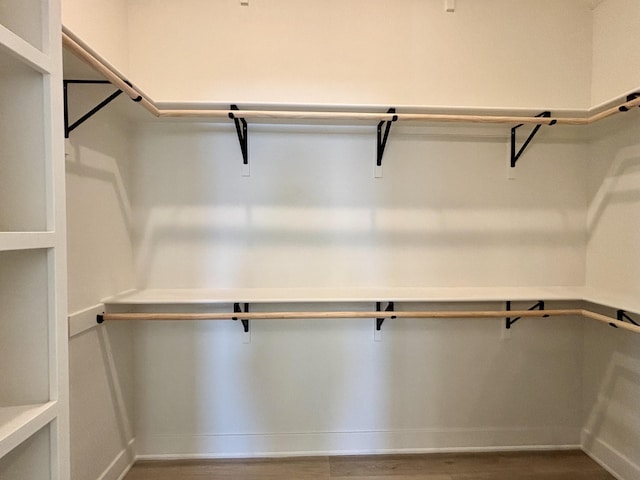 spacious closet featuring hardwood / wood-style floors