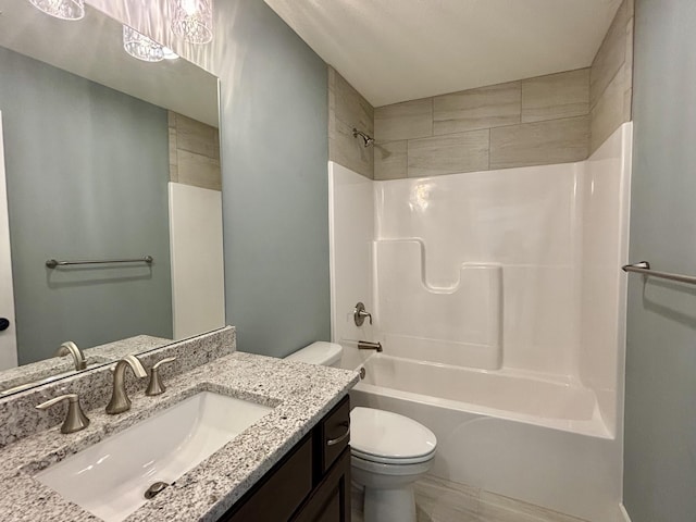 full bathroom with vanity, toilet, and bathing tub / shower combination