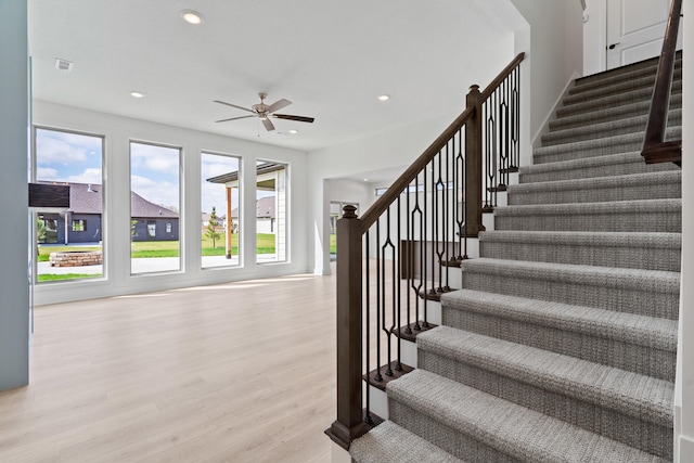 6504 Walsby Dr, Columbia, MO 65201 - stairway with recessed lighting, wood finished floors, visible vents, a ceiling fan, and baseboards