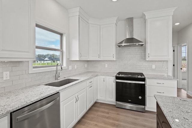 6504 Walsby Dr, Columbia, MO 65201 - kitchen featuring white cabinets, stainless steel dishwasher, a sink, wall chimney exhaust hood, and range with gas stovetop