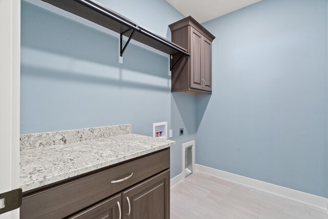 6504 Walsby Dr, Columbia, MO 65201 - clothes washing area featuring baseboards, hookup for an electric dryer, cabinet space, and washer hookup